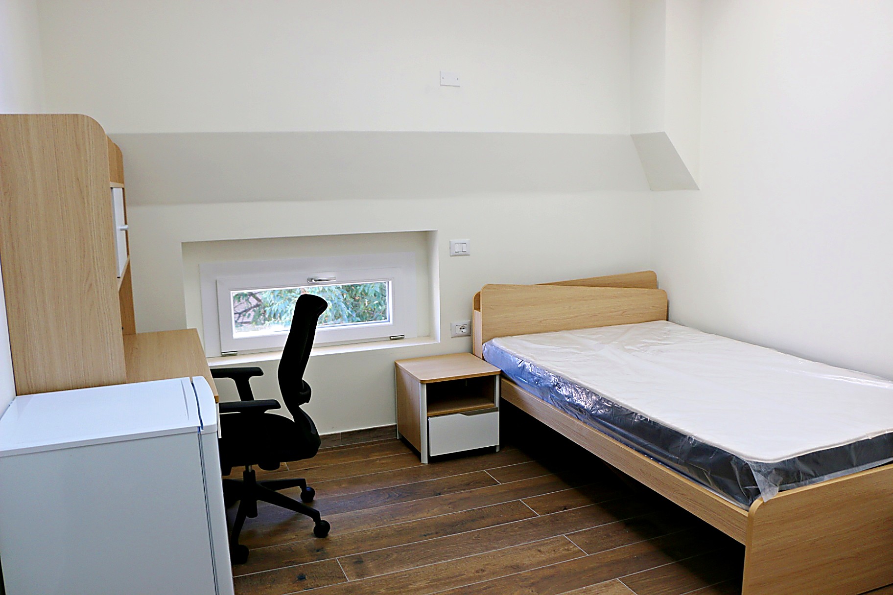 Single room with a low horizontal window